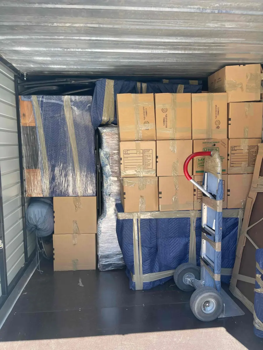 The inside of a NewView truck, packed tight with boxes and padded furniture